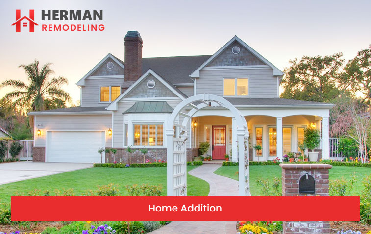 Exterior view of a modern home addition featuring a well-maintained facade and landscaped garden.